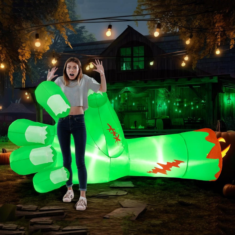 9ft zombie arm Halloween inflatable illuminated at night in a yard