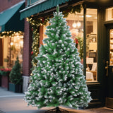 Unlit artificial pine Christmas tree with a Christmas tree skirt