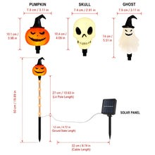 Close up of a pumpkin shaped solar ground light with its removable solar panel