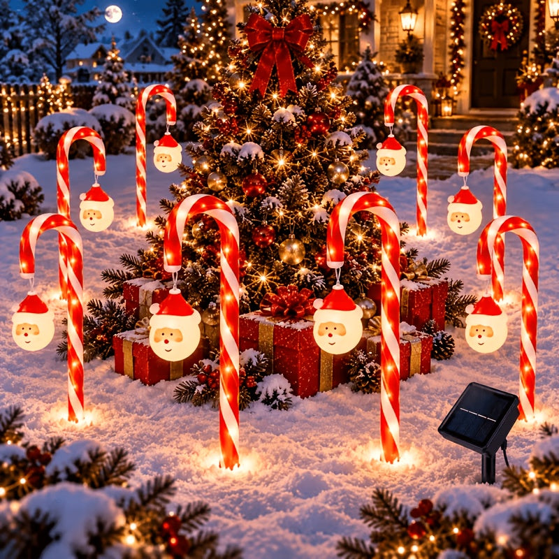 Candy cane solar lights lining a garden border in winter
