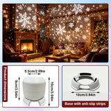 Snowflake projection spread over a wall and ceiling in a dark room
