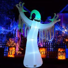 9.85-foot white inflatable ghost decoration glowing at night in an outdoor Halloween yard display