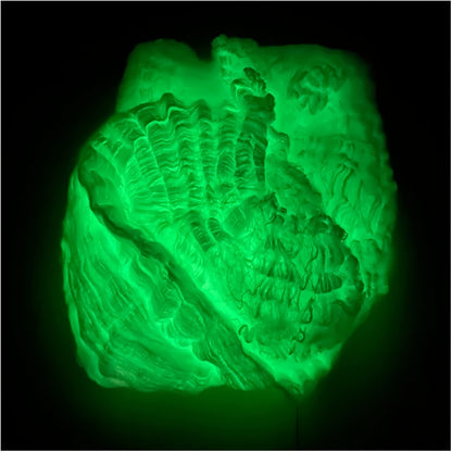 Close view of luminous web strands showing the uneven fiber texture