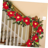 Lighted flower garland draped across a fireplace mantel