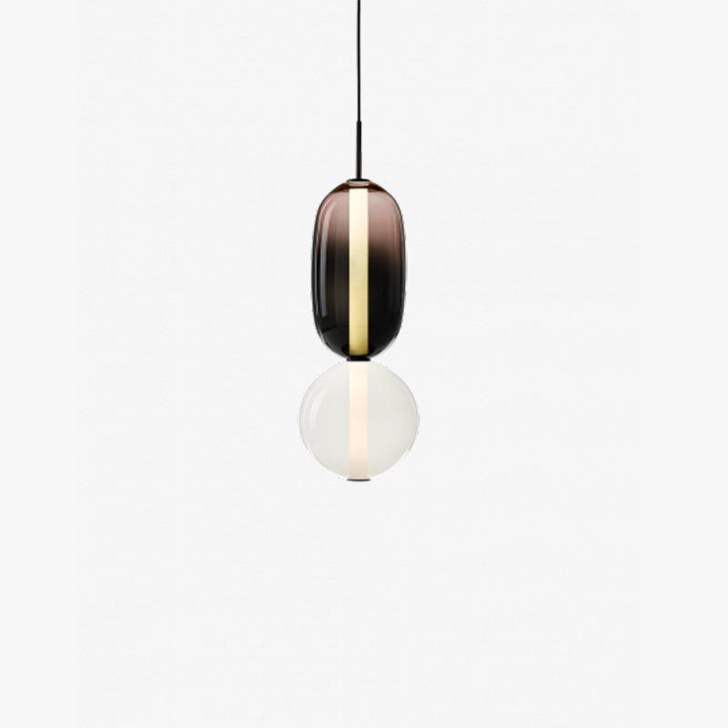 Rounded bubble-style tinted glass pendant shade lit and hanging