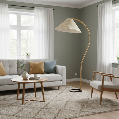 Caprani floor lamp with beige linen shade beside a reading chair