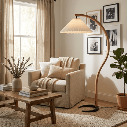 Caprani floor lamp with beige linen shade beside a reading chair