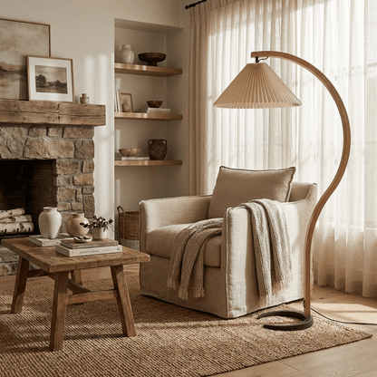 Caprani beechwood floor lamp with white linen shade in a living room