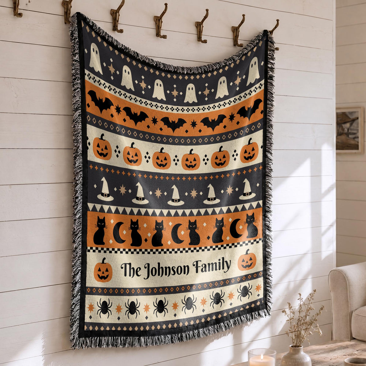 Close-up of the woven Halloween blanket's textured fabric and fringe edge