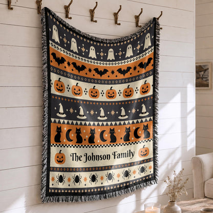 Close-up of the woven Halloween blanket's textured fabric and fringe edge