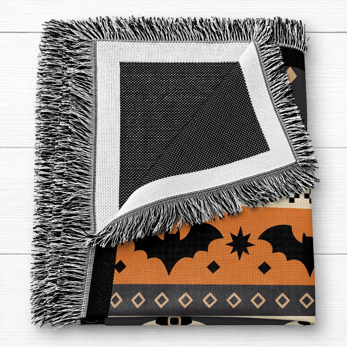 Personalized woven Halloween blanket draped over a sofa