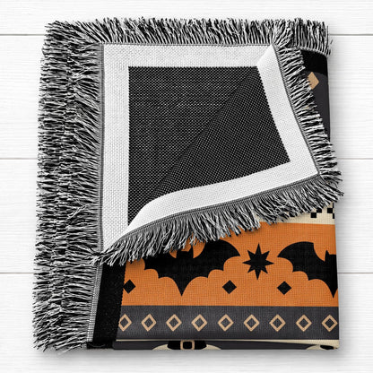 Personalized woven Halloween blanket draped over a sofa