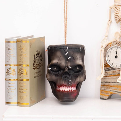 Halloween hanging skull prop with mouth open mid-animation