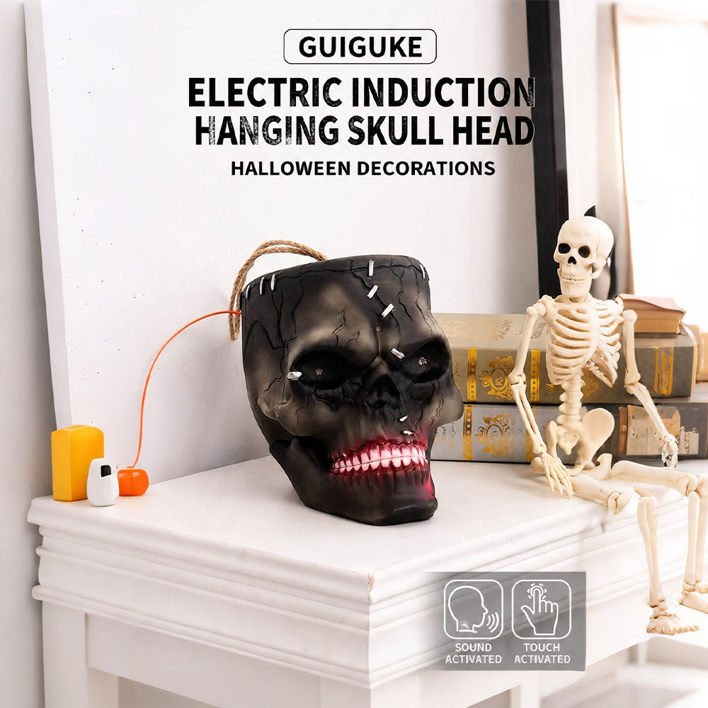 Side view of sound-activated hanging skull prop