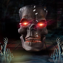 Hanging Halloween skull prop with glowing red eyes