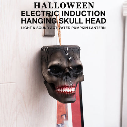 Halloween animatronic skull lit up at night