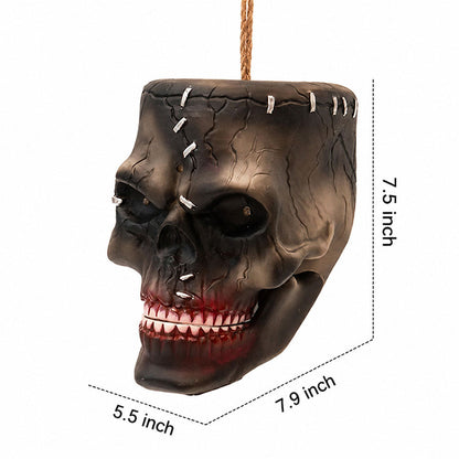 Halloween hanging skull prop displayed against a dark background