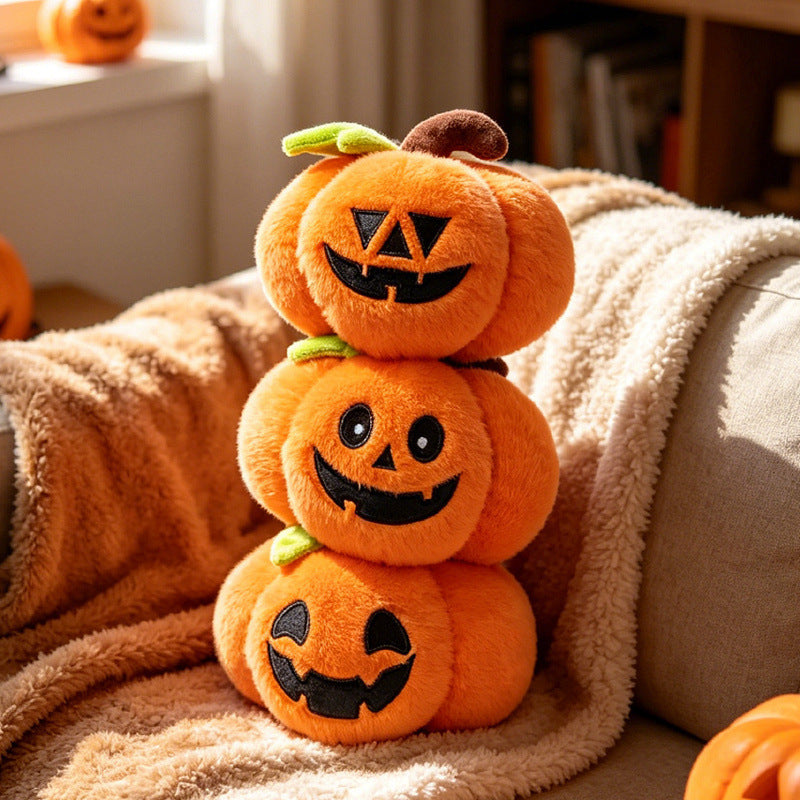 Pumpkin plush set arranged on a shelf for Halloween decor