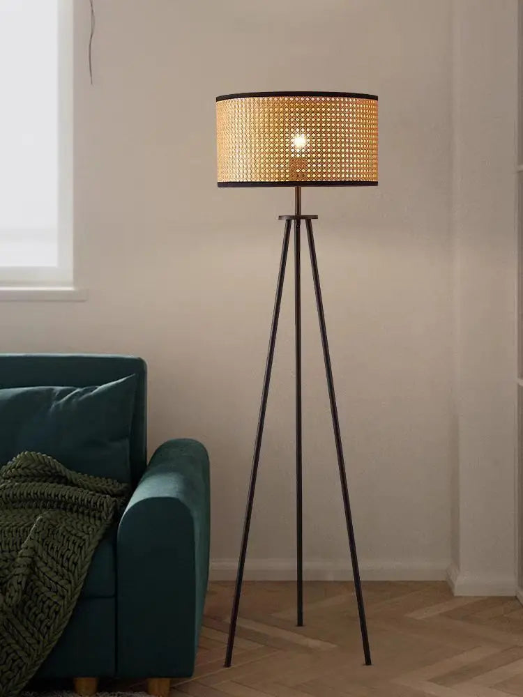 Iron base detail on rattan floor lamp