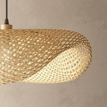 Amara bamboo chandelier hanging over a light, airy boho living room