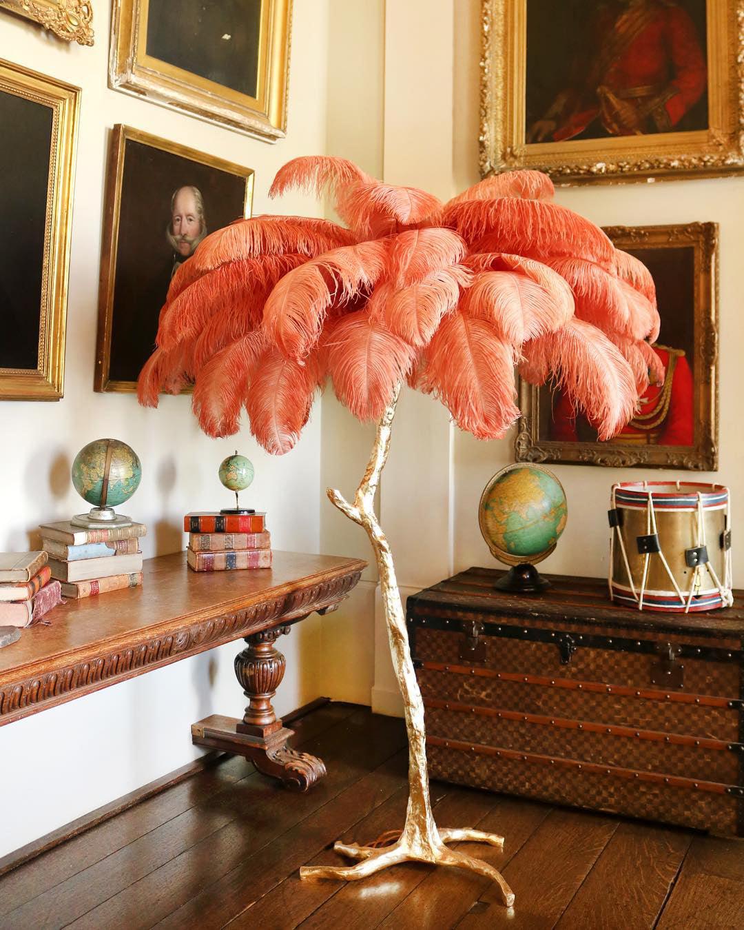 Ostrich feather floor lamp with silver base in a living room corner