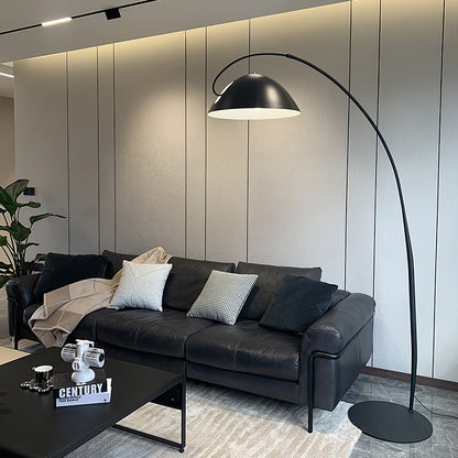 Verse arc floor lamp large size shown next to a sofa for scale