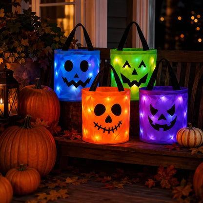 Four LED light-up Halloween trick-or-treat buckets in purple, green, blue, and orange with jack-o-lantern faces
