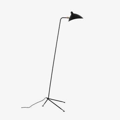 Arm Spider floor lamp in a reading corner setting