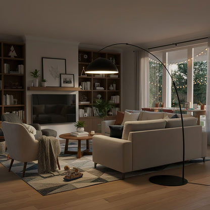 Verse arc floor lamp with black tapered metal stem in a living room setting