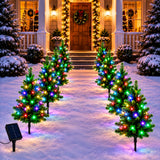 Mini tree lights pushed into a flower bed border