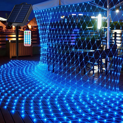 Solar net lights glowing white at night