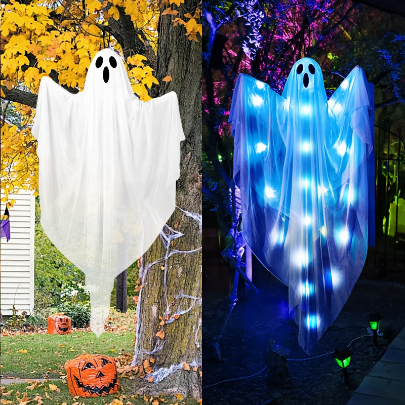 Hanging ghost decoration on tree branch