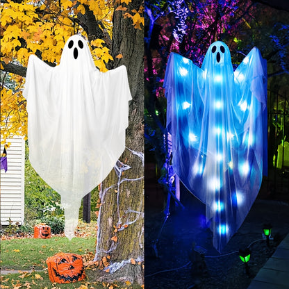 Hanging ghost decoration on tree branch