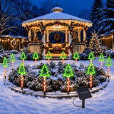 Eight pack of Christmas tree shaped solar stake lights