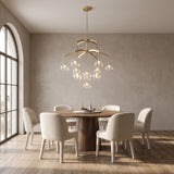 Adelina globe chandelier above a round walnut dining table