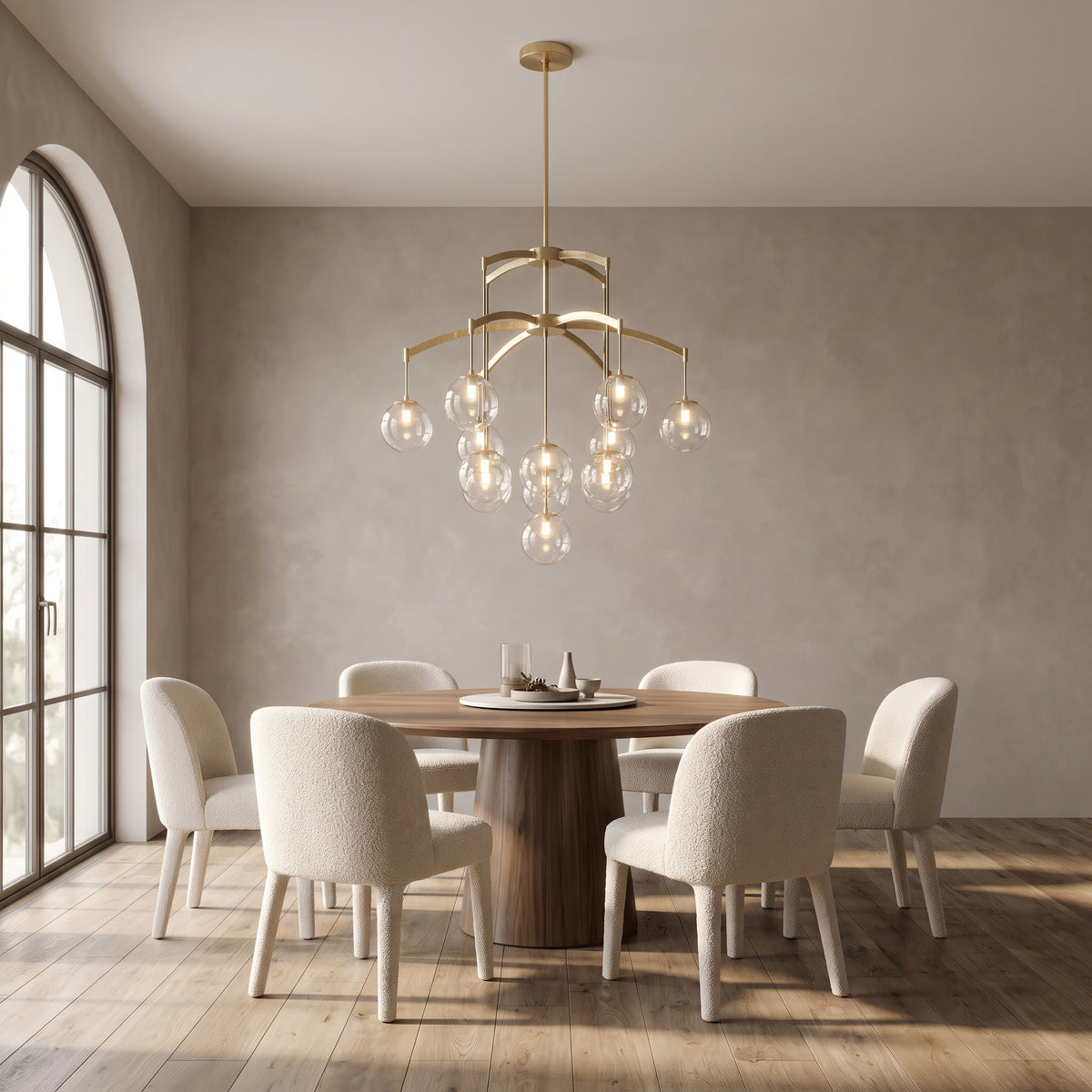 Adelina globe chandelier above a round walnut dining table