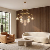 Adelina brushed gold globe chandelier in a warm living room
