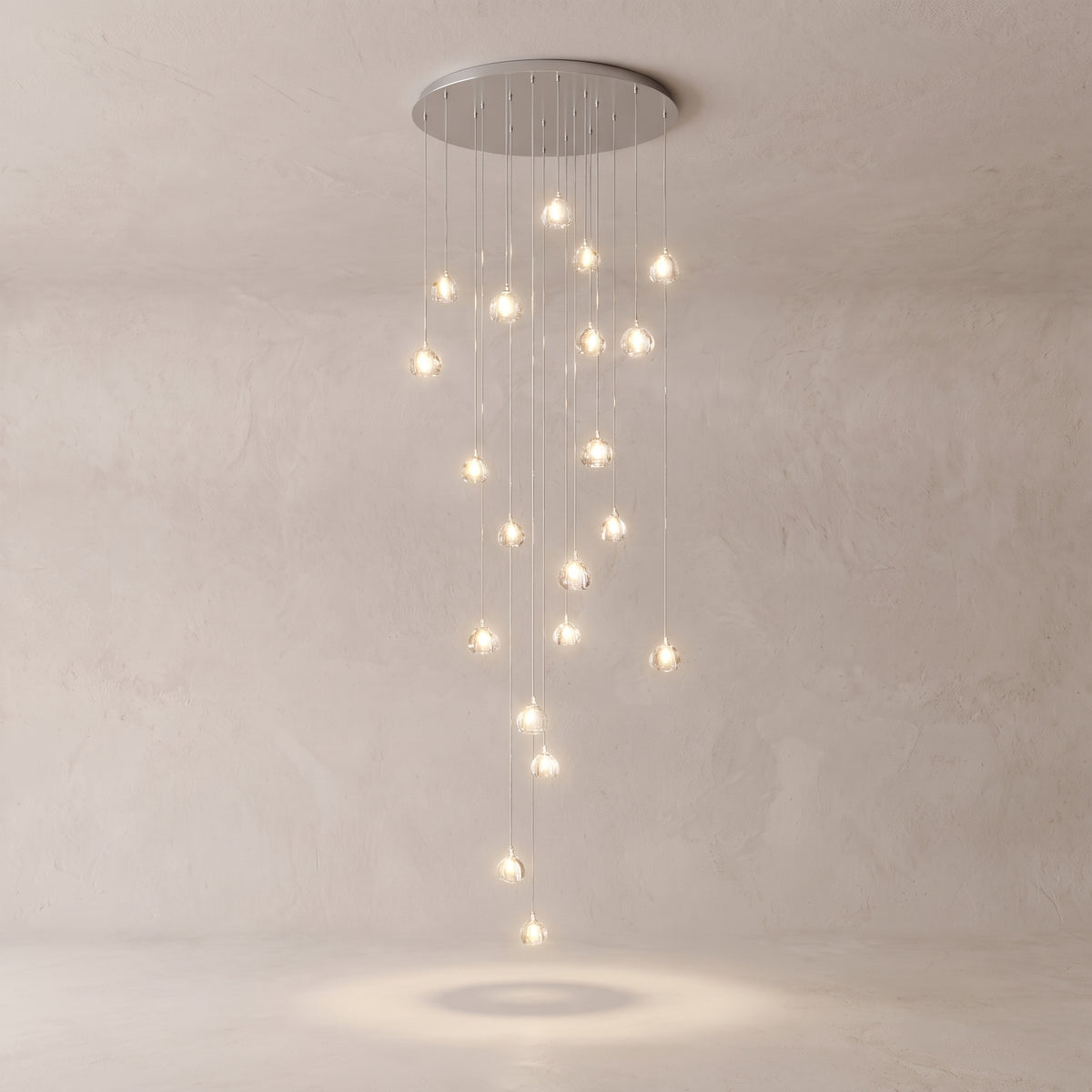 Astra crystal staircase chandelier on a warm light grey studio background