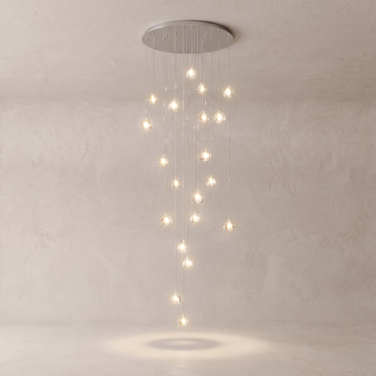 Astra crystal staircase chandelier on a warm light grey studio background
