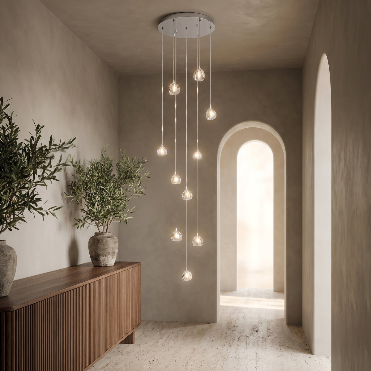 Astra crystal staircase chandelier in an elegant entry hall