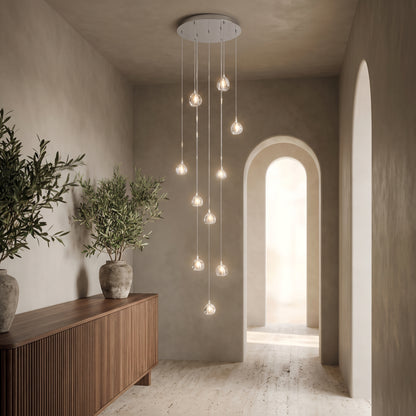 Astra crystal staircase chandelier in an elegant entry hall