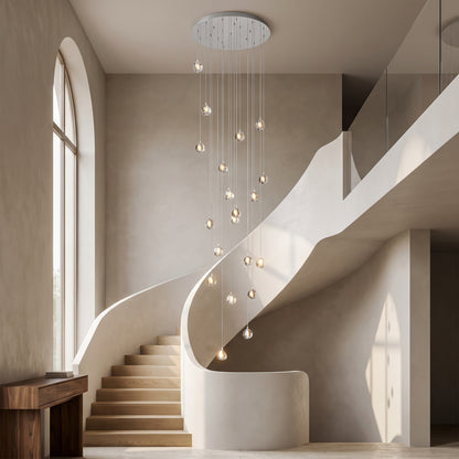 Astra silver crystal staircase chandelier cascading in a double-height stairwell