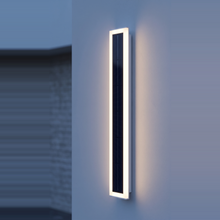 Axis Solar Outdoor LED Wall Light mounted on exterior wall at dusk