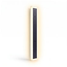 Axis Solar wall light studio shot, angled, lit warm white on white background