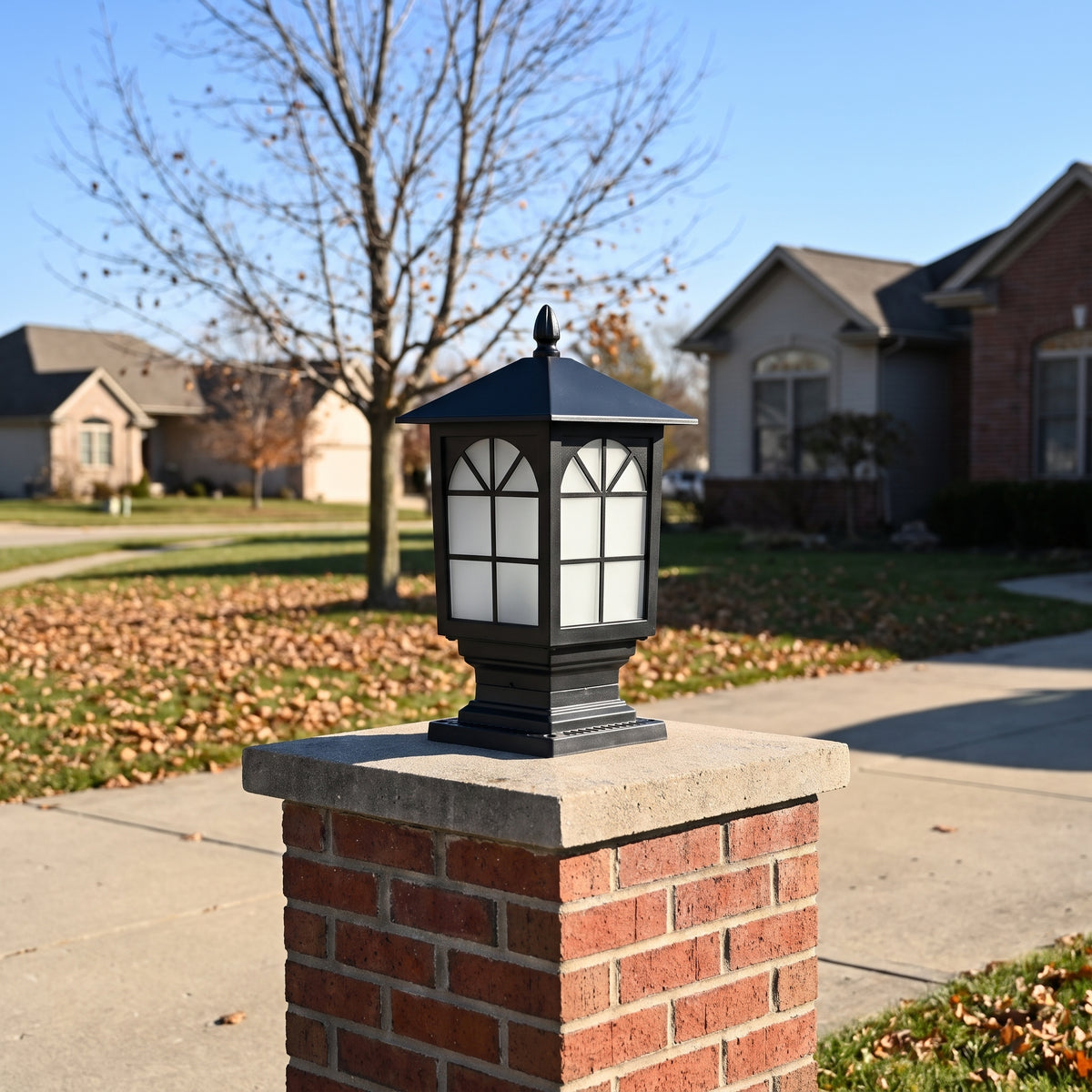 Birchwood arched window post light on a brick driveway pillar on a clear late-autumn day