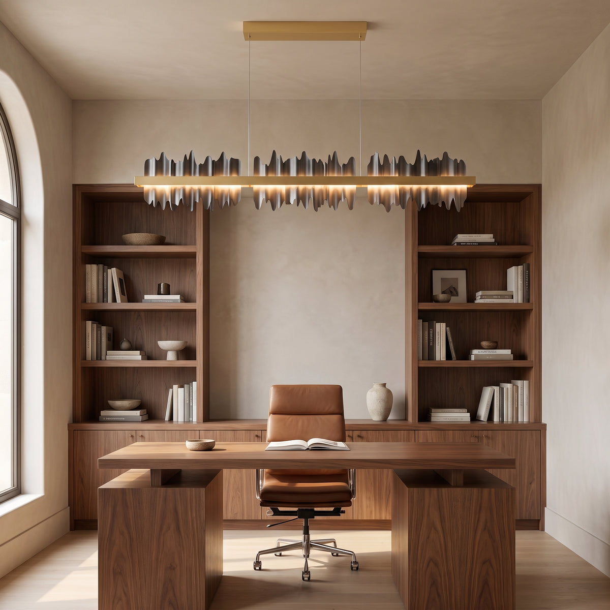 Cascade linear chandelier in jet black above a walnut desk