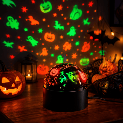 Pumpkin and ghost projection lamp casting patterns on a wall