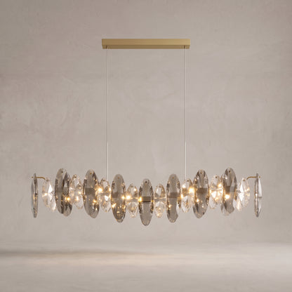 Celestial crystal pendant light on a warm light grey studio background