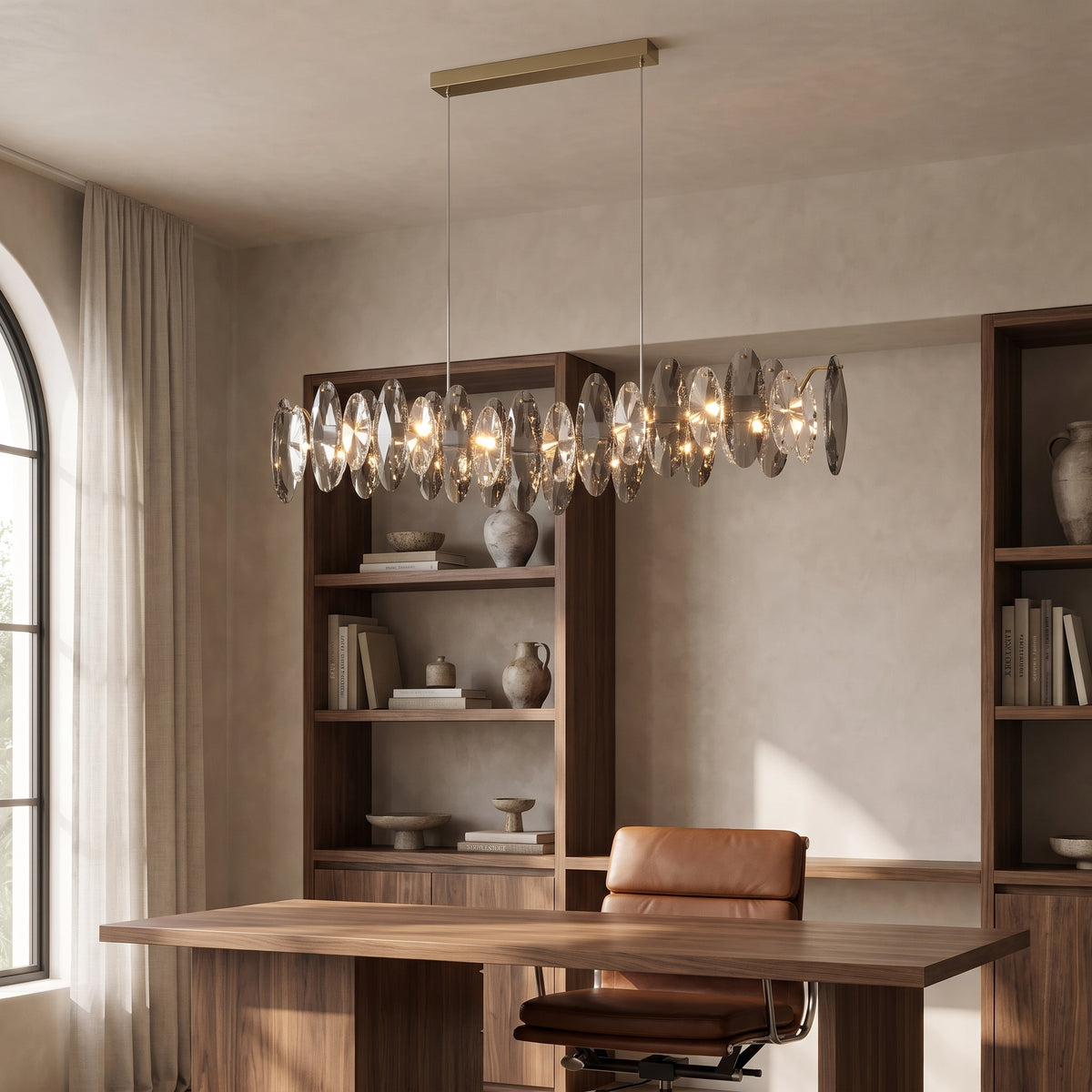 Celestial crystal pendant light above a walnut desk in a home office