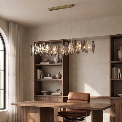 Celestial crystal pendant light above a walnut desk in a home office